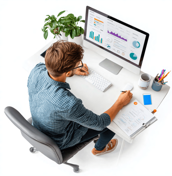 Man sitting at a computer looking at data visualizations